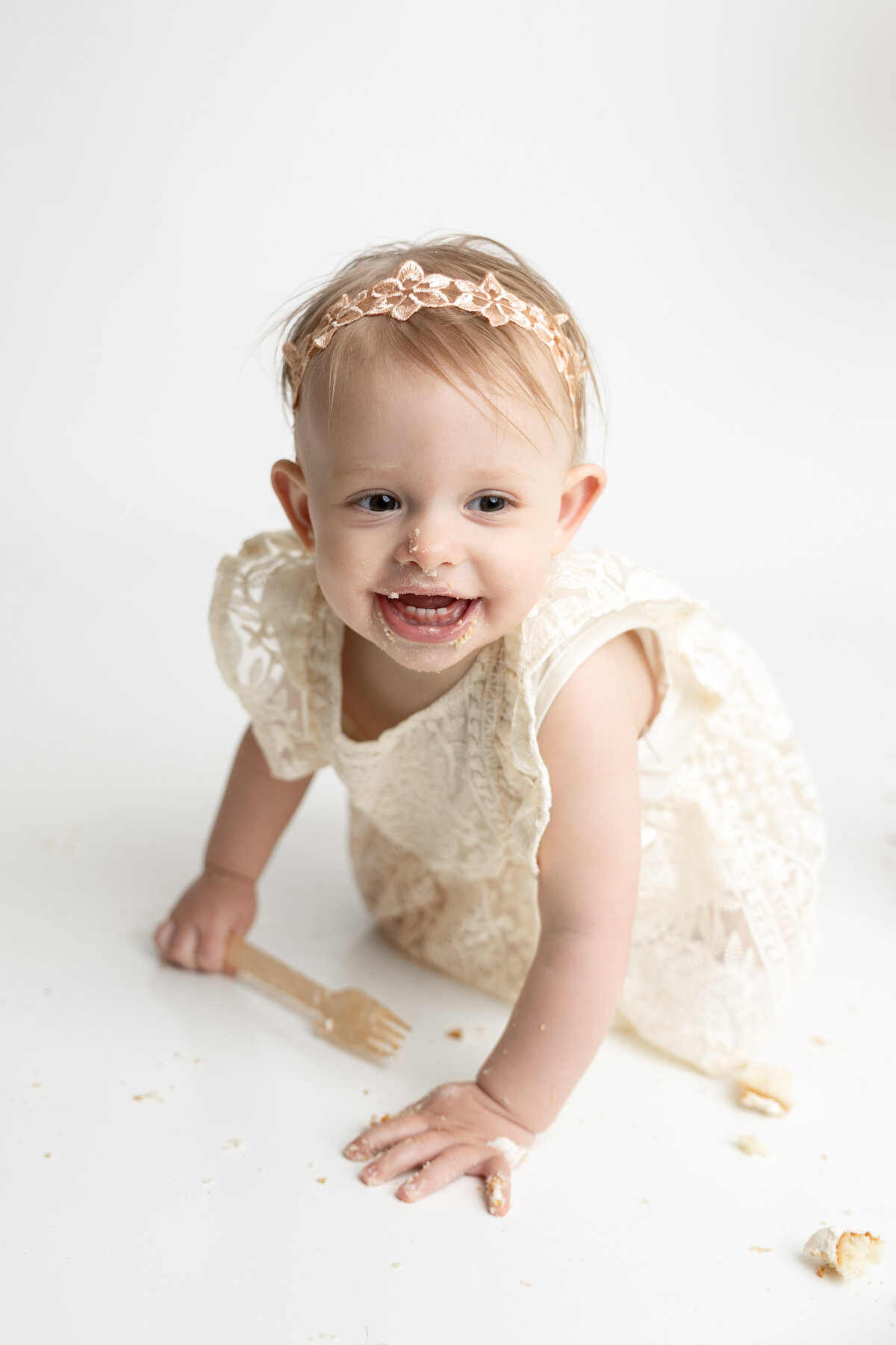 Minimalist cake smash with large white balloon and greenery