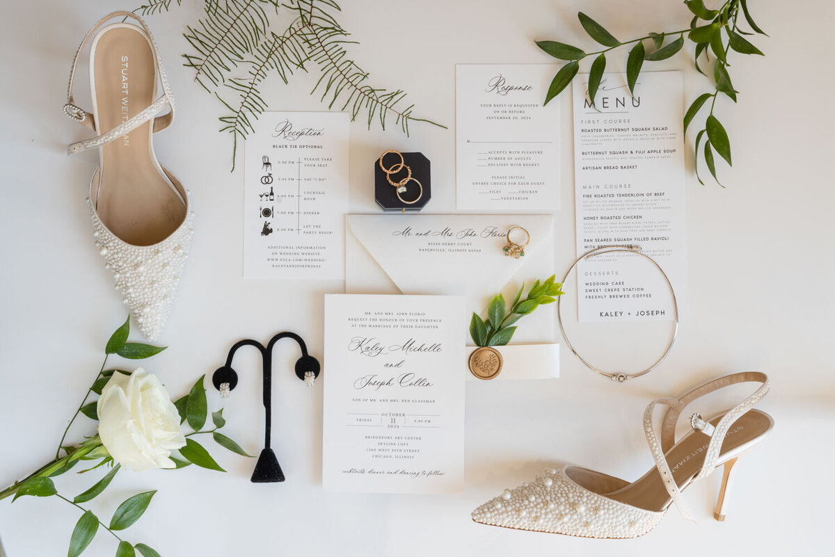 A wedding invitation is laying on a table