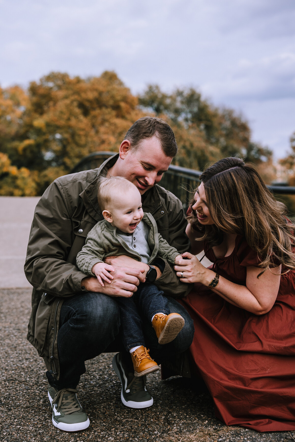Family of three for a first birthday in Allegheny Commons Park. 