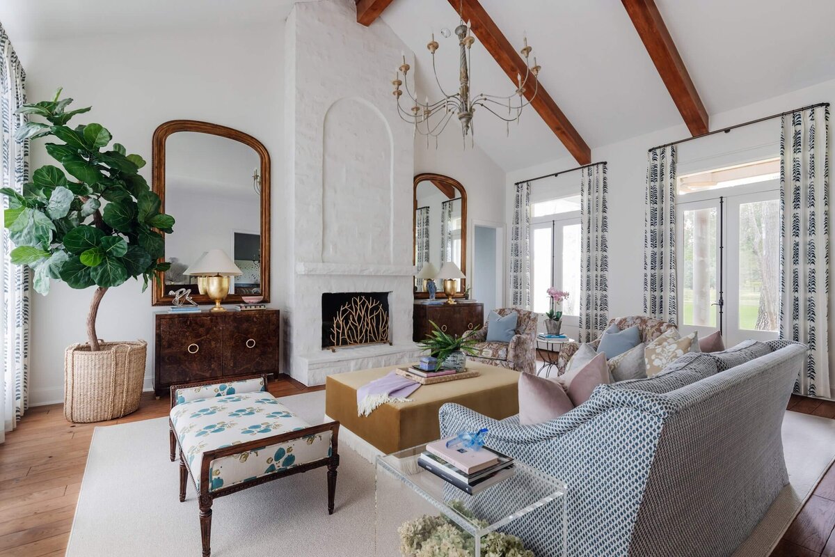 oyster creek studios natural wood beams living room patterned chairs