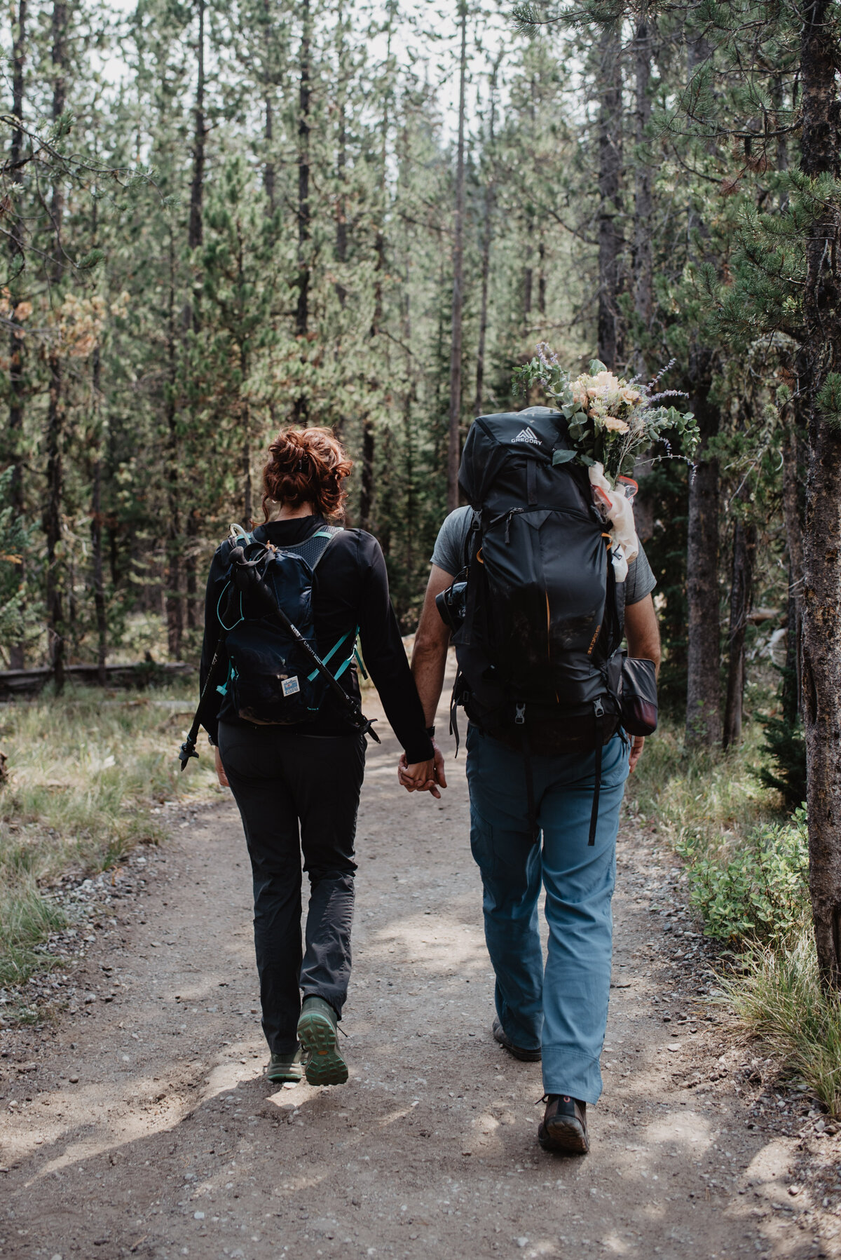 Jackson Hole photographers capture couple holding hands while hiking
