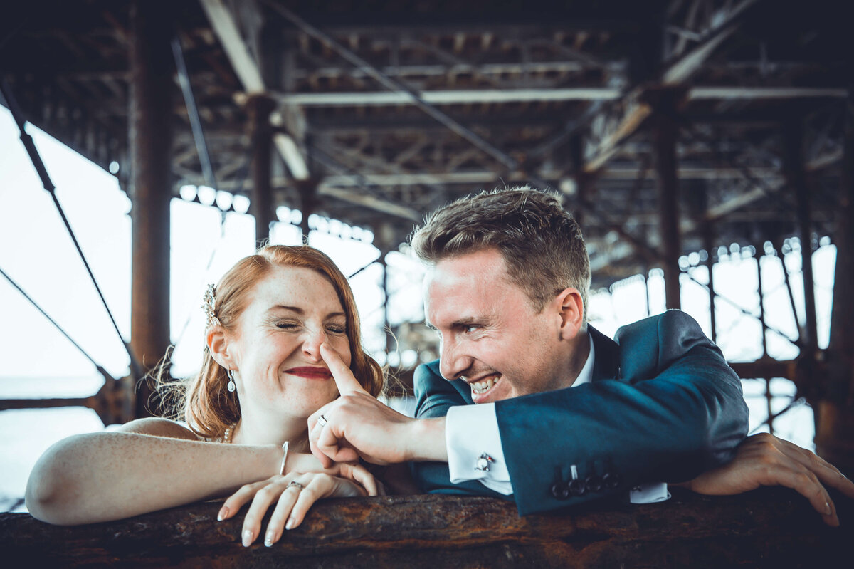 wedding-couple-worthing-pier-underneath-beach