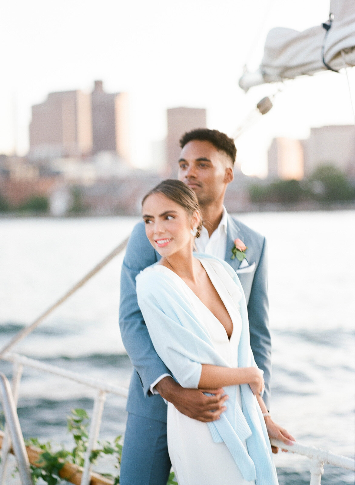 Kate-Murtaugh-Events-elopement-wedding-planner-Boston-Harbor-sailing-sail-boat-yacht-greenery-water-city-skyline-couple-just-married
