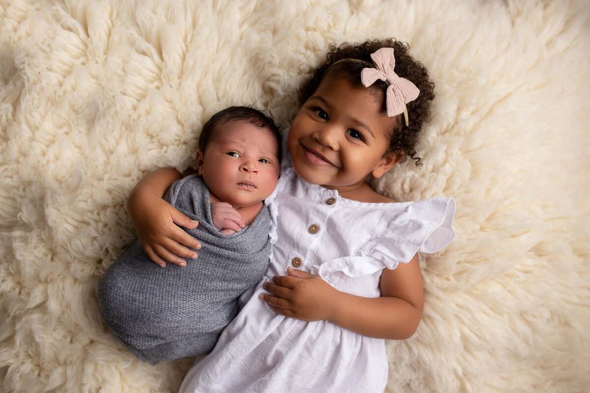 Newborn and older sibling in Santa Clarita photography studio