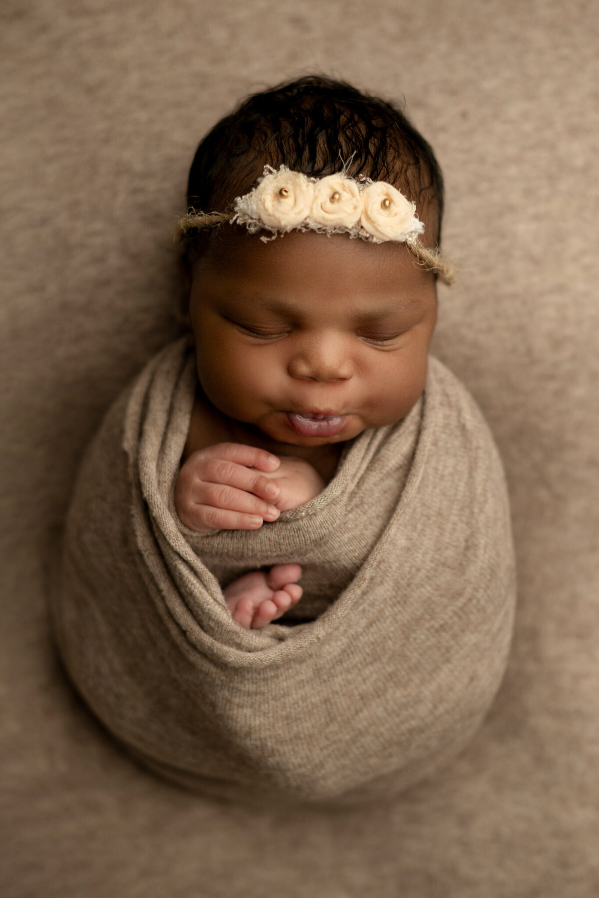 Newborn baby girl all wrapped up