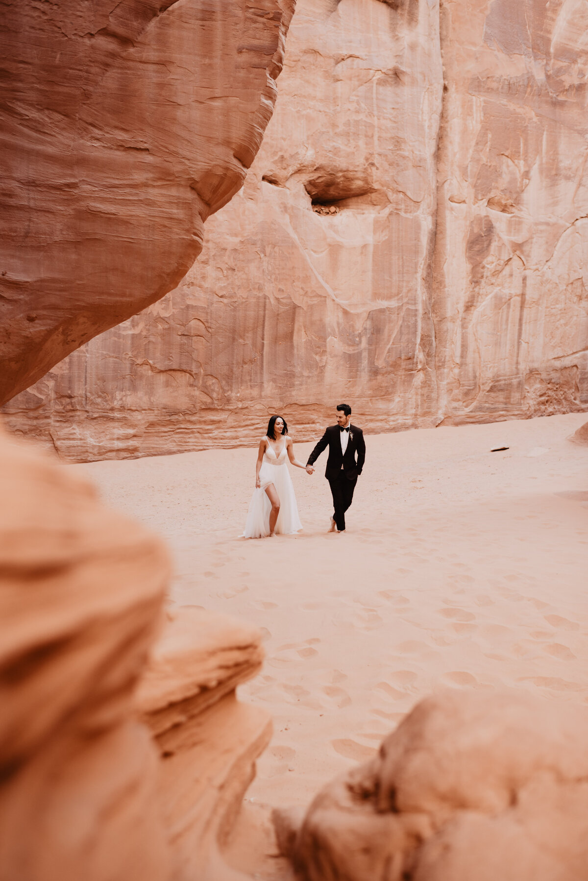 Utah elopement photographer captures couple walking hand in hand