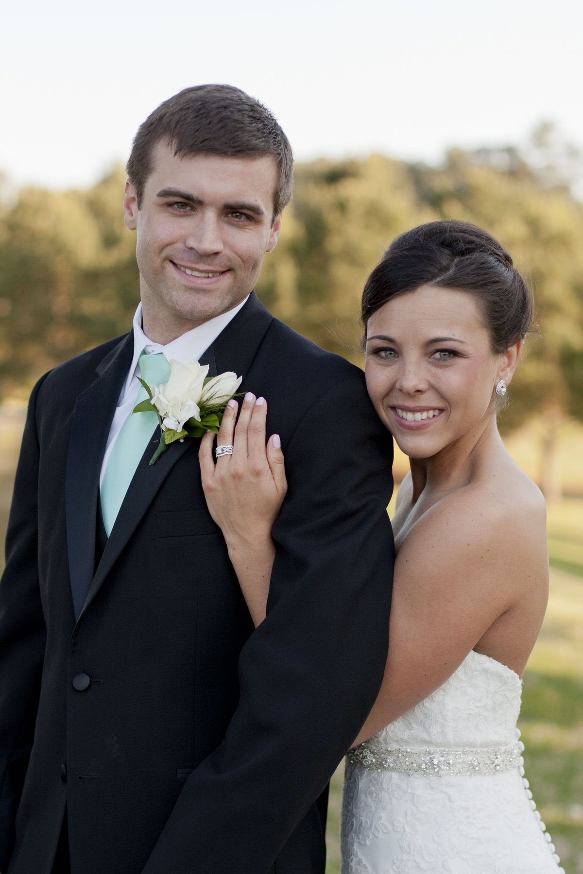 Bride and Groom posing at Summit Chase Country Club golf course