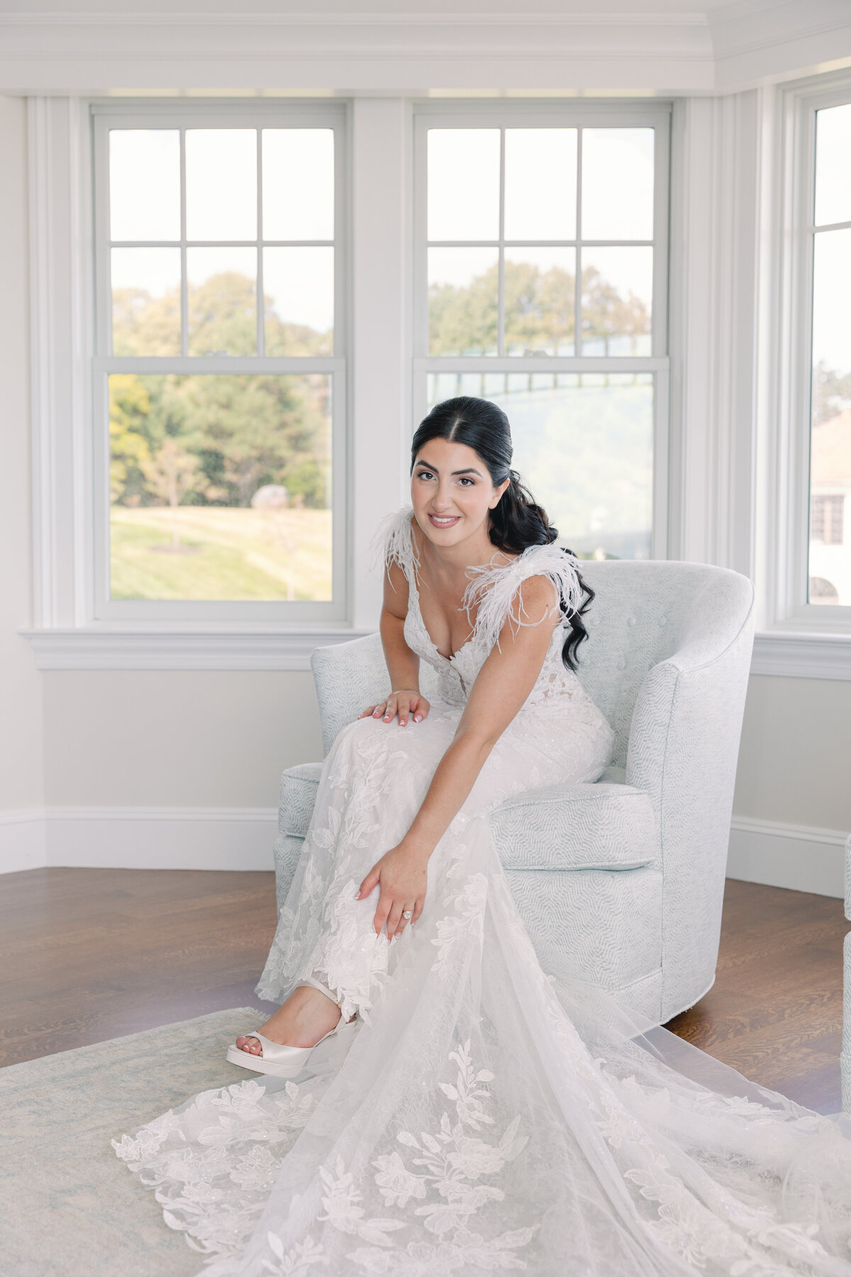getting ready with the bride shes getting her shoes 