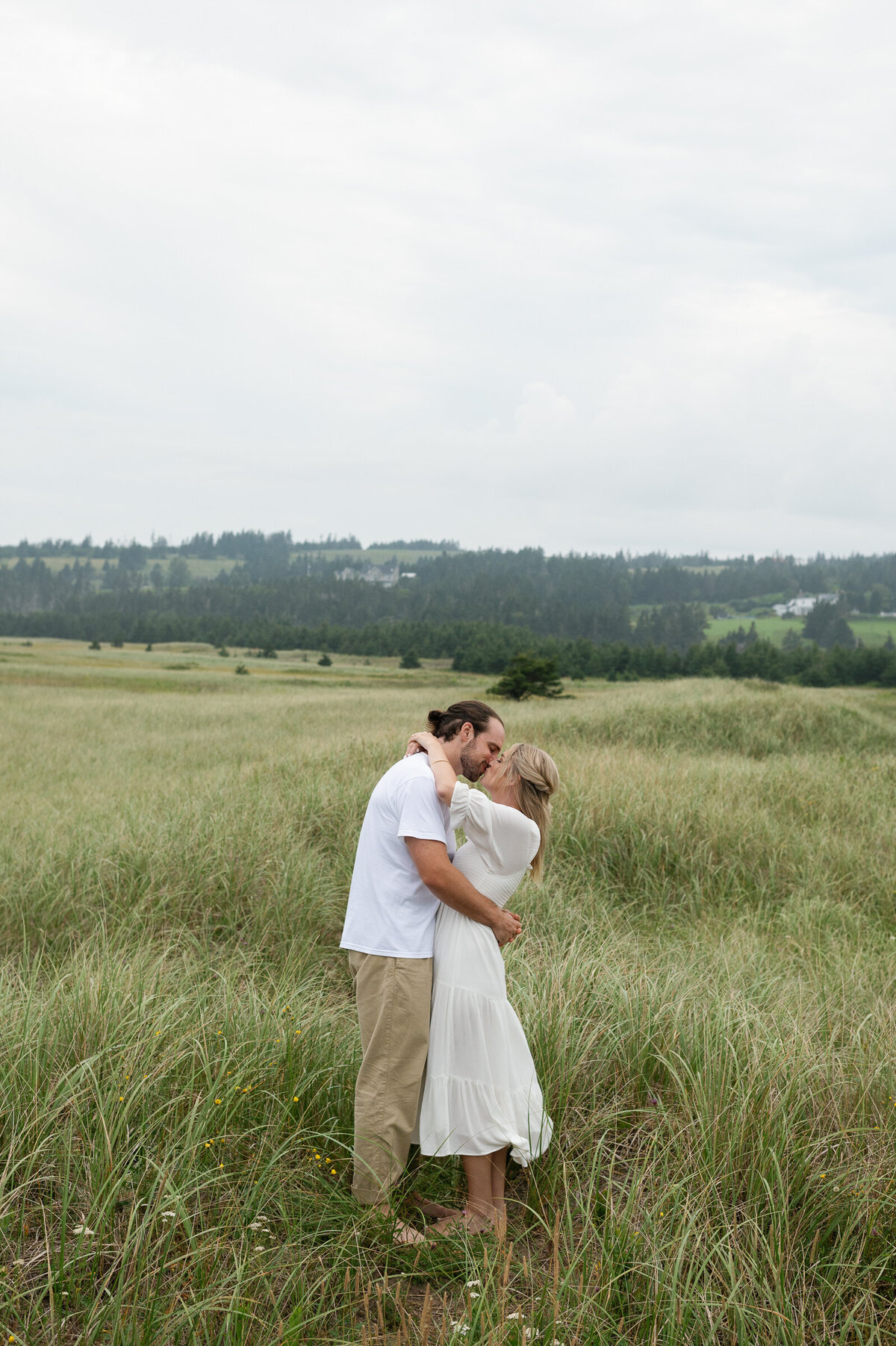 Couple embrace at conrad's beach in lawrencetown