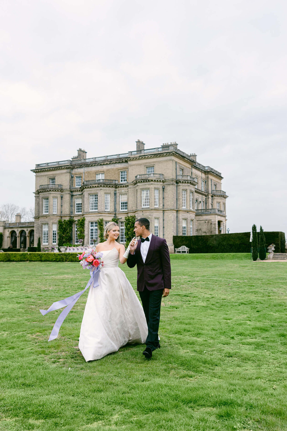 A wedding day photo of the bride and groom at Hedsor House in the Uk