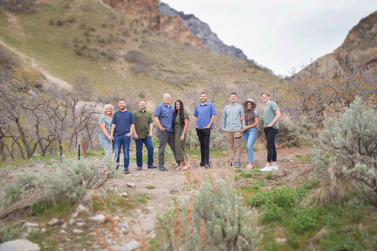 Family standing together in Rock Canyon Park