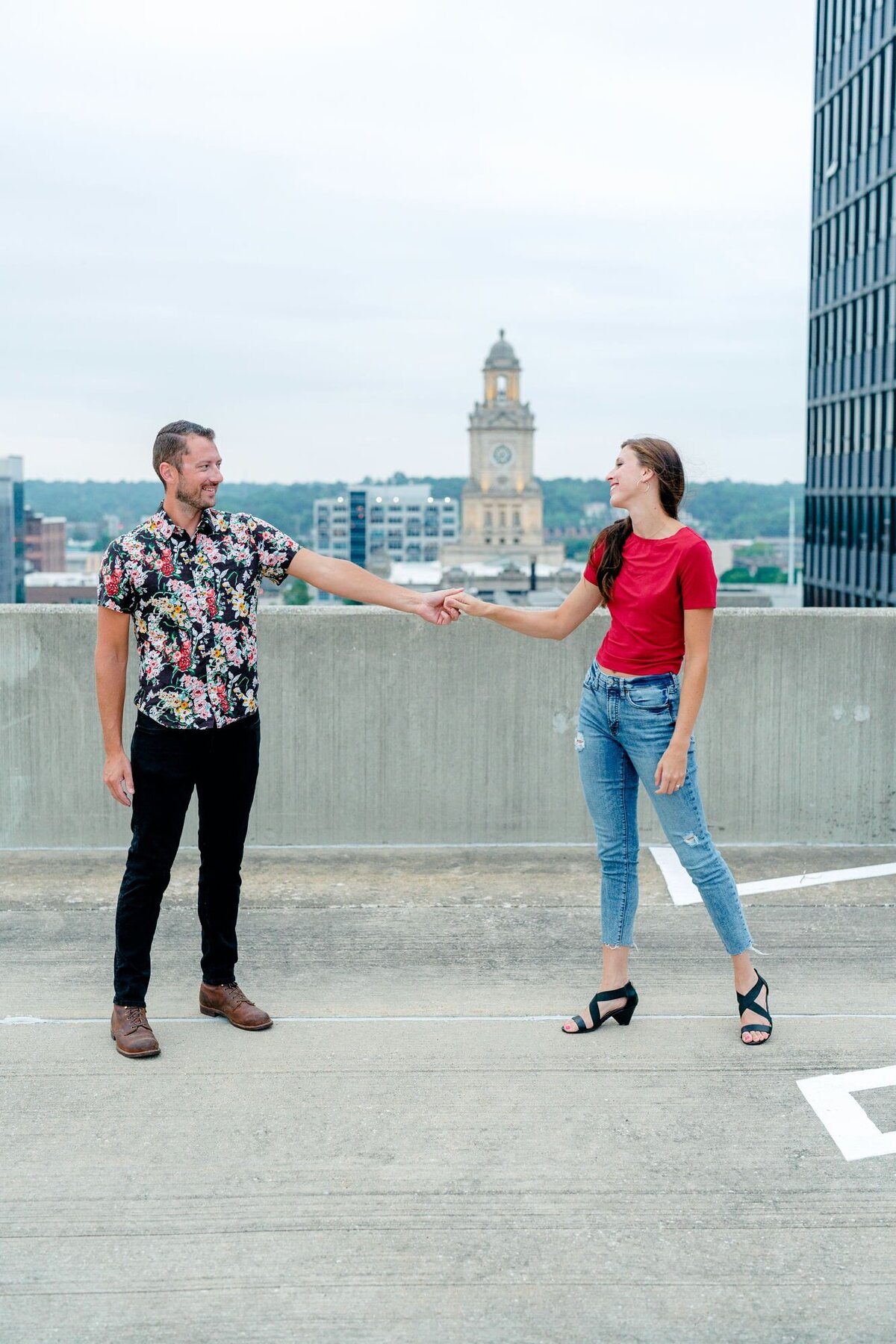 couple-holding-hands-cityscape-background