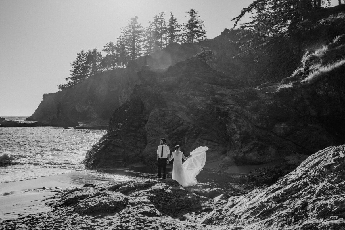 black and white of couple on beach at sunset for redwood elopement