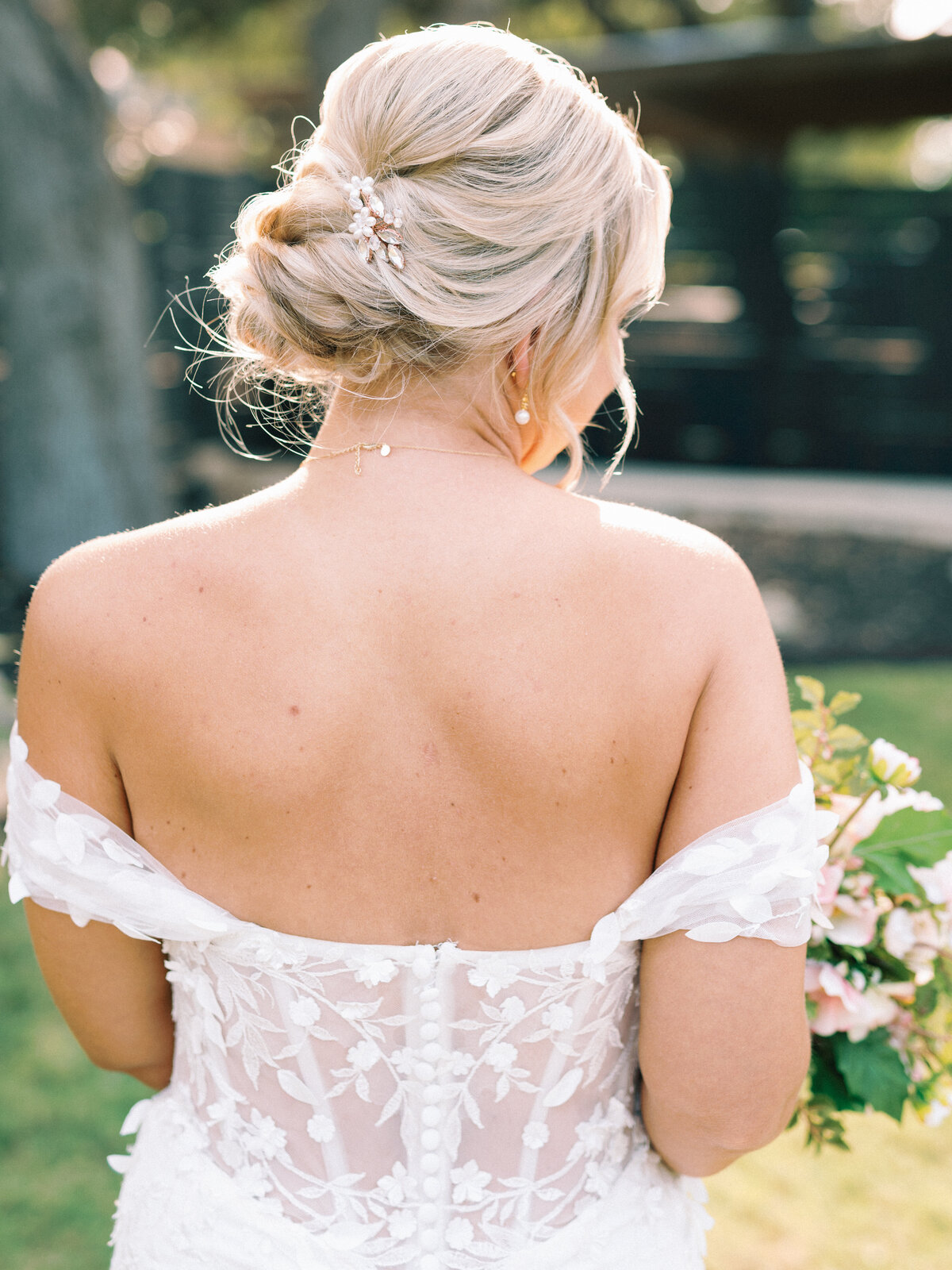 blonde bride in dress with flowers