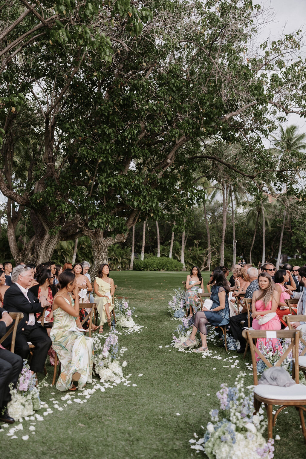 wedding ceremony at lanikuhonua with winding aisle guests seated