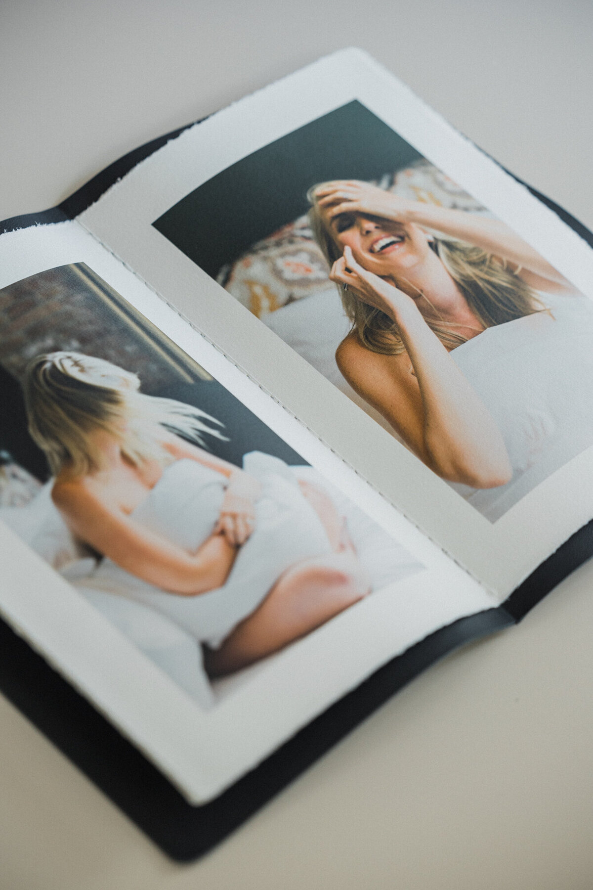 A little black book filled with boudoir photos to gift to a partner