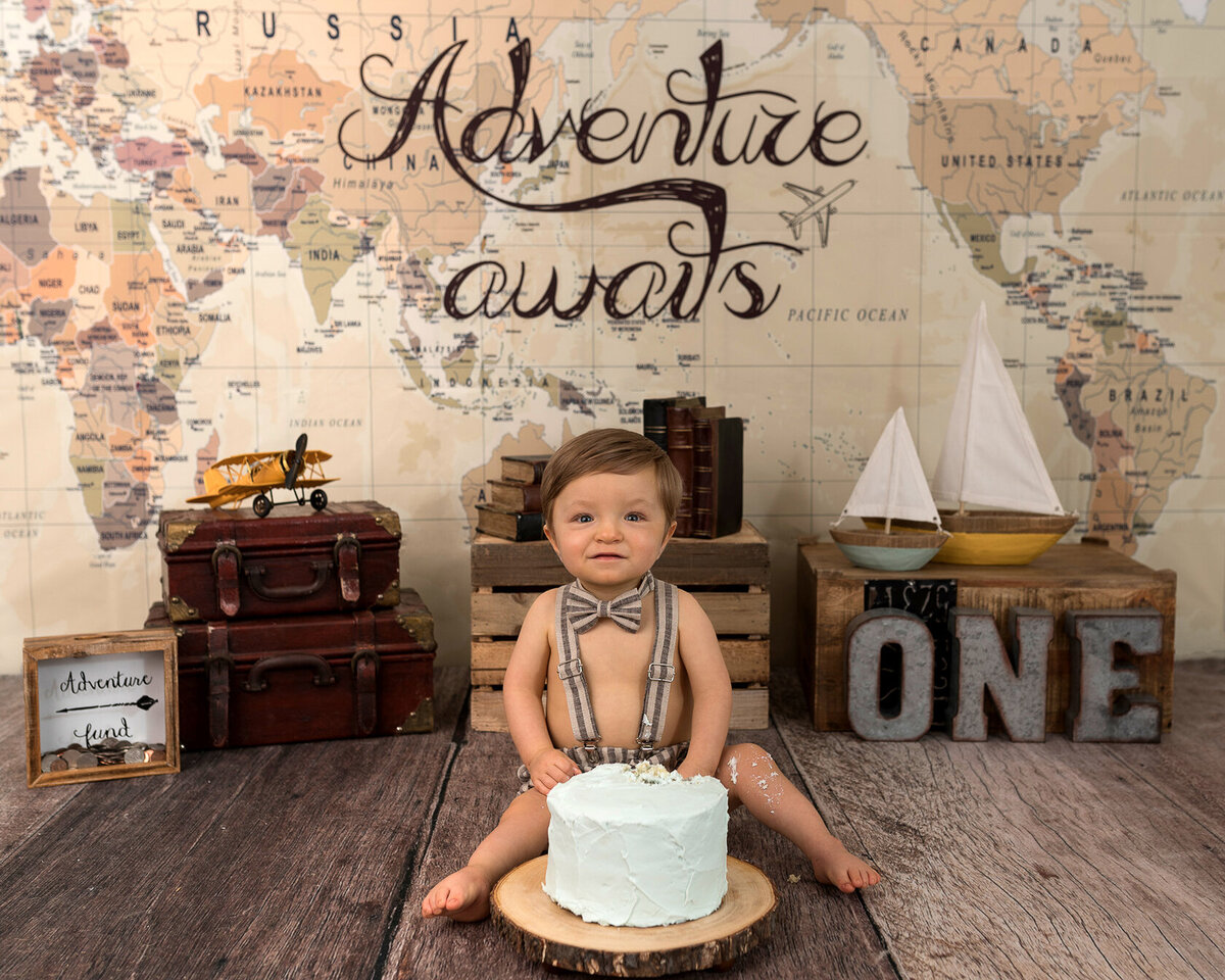 Adventure and Travel baby cake smash themed photoshoot by Laura King