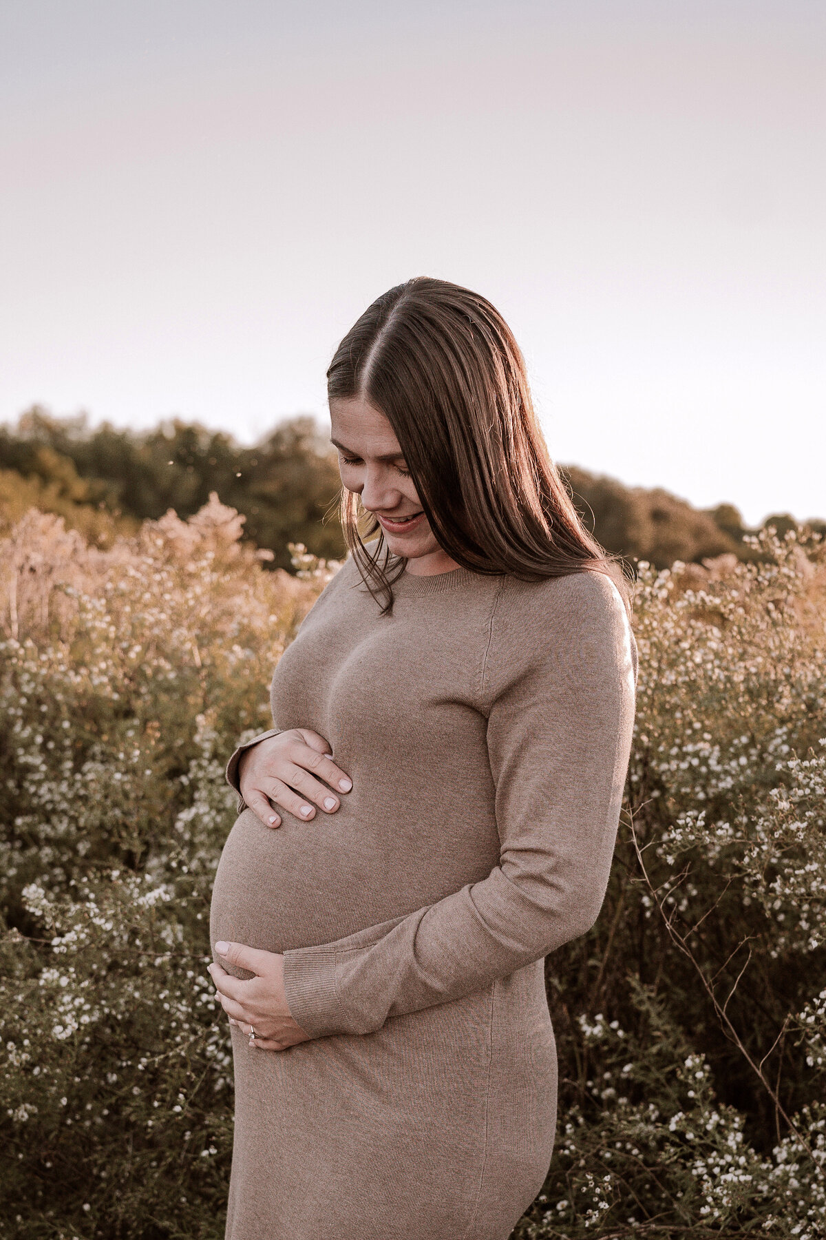 mom embracing baby bump