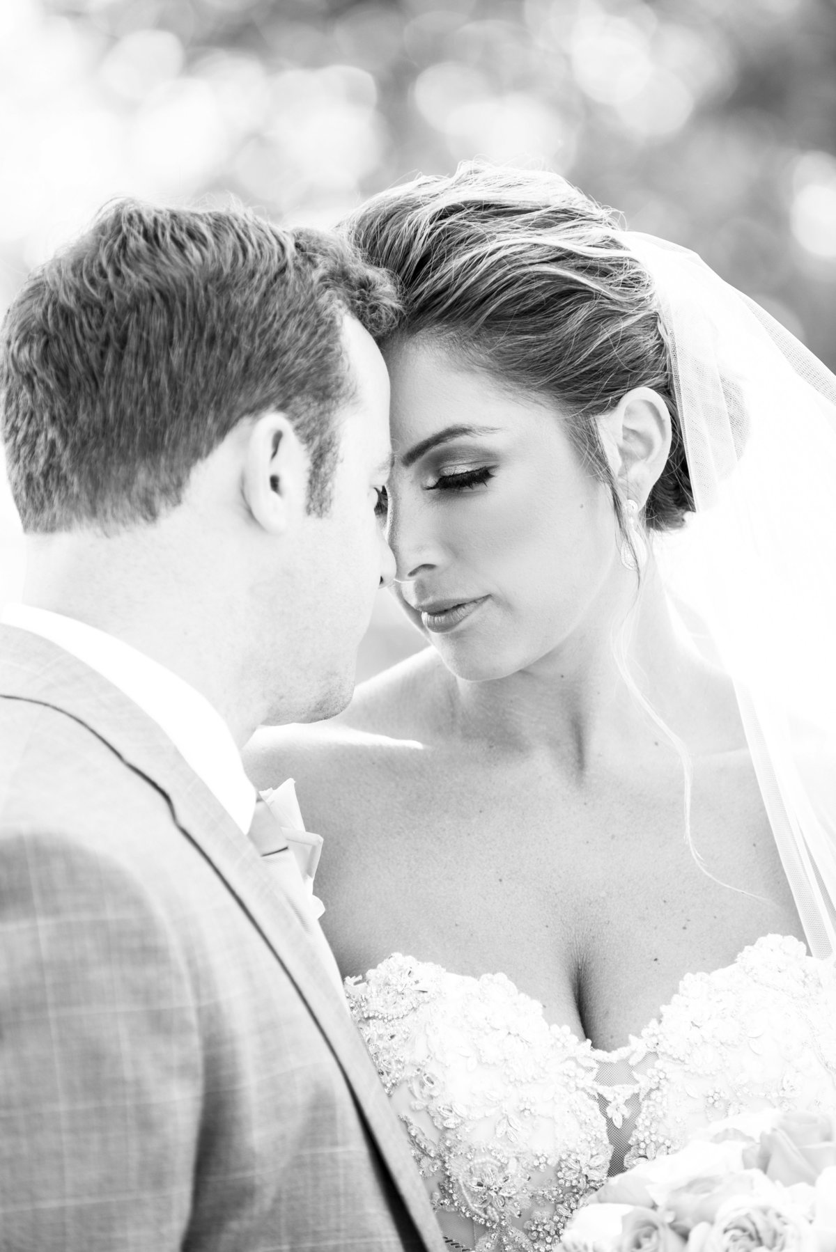 bride and groom cuddling in spring lake yacht club wedding