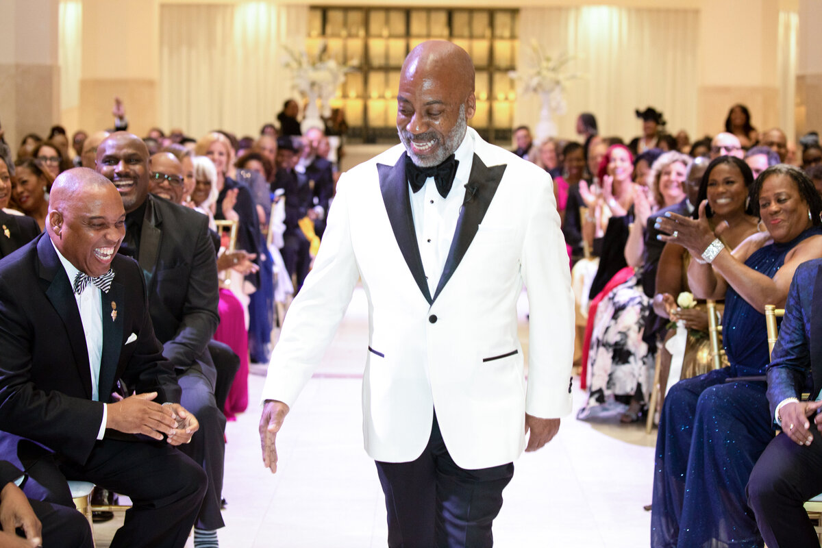 southern-exchange-ballroom-atlanta-groom-entrance-guests-laughing