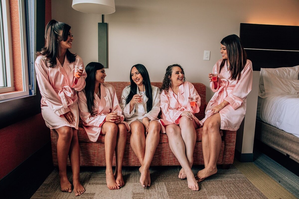 candid photo of the bride and her bridesmaids in bridal suite