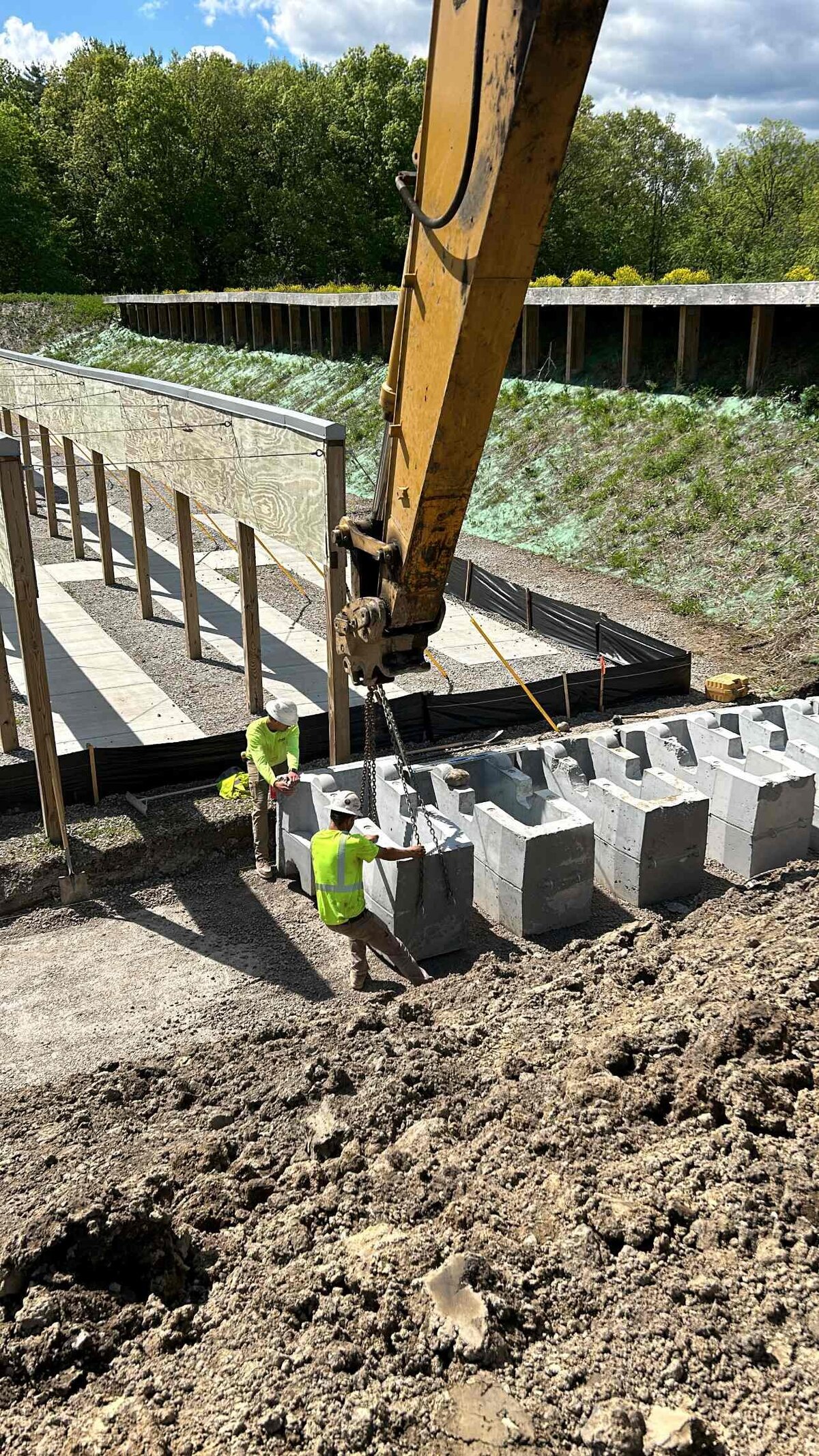 redi-rock-retaining-wall-placement-michigan-correctional-facility-highland-services-teamwork