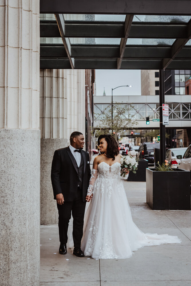 des-moines-wedding-couple-downtown-walk-surety-hotel-des-moines-wedding-photographer-storyteller-collective-photo-co