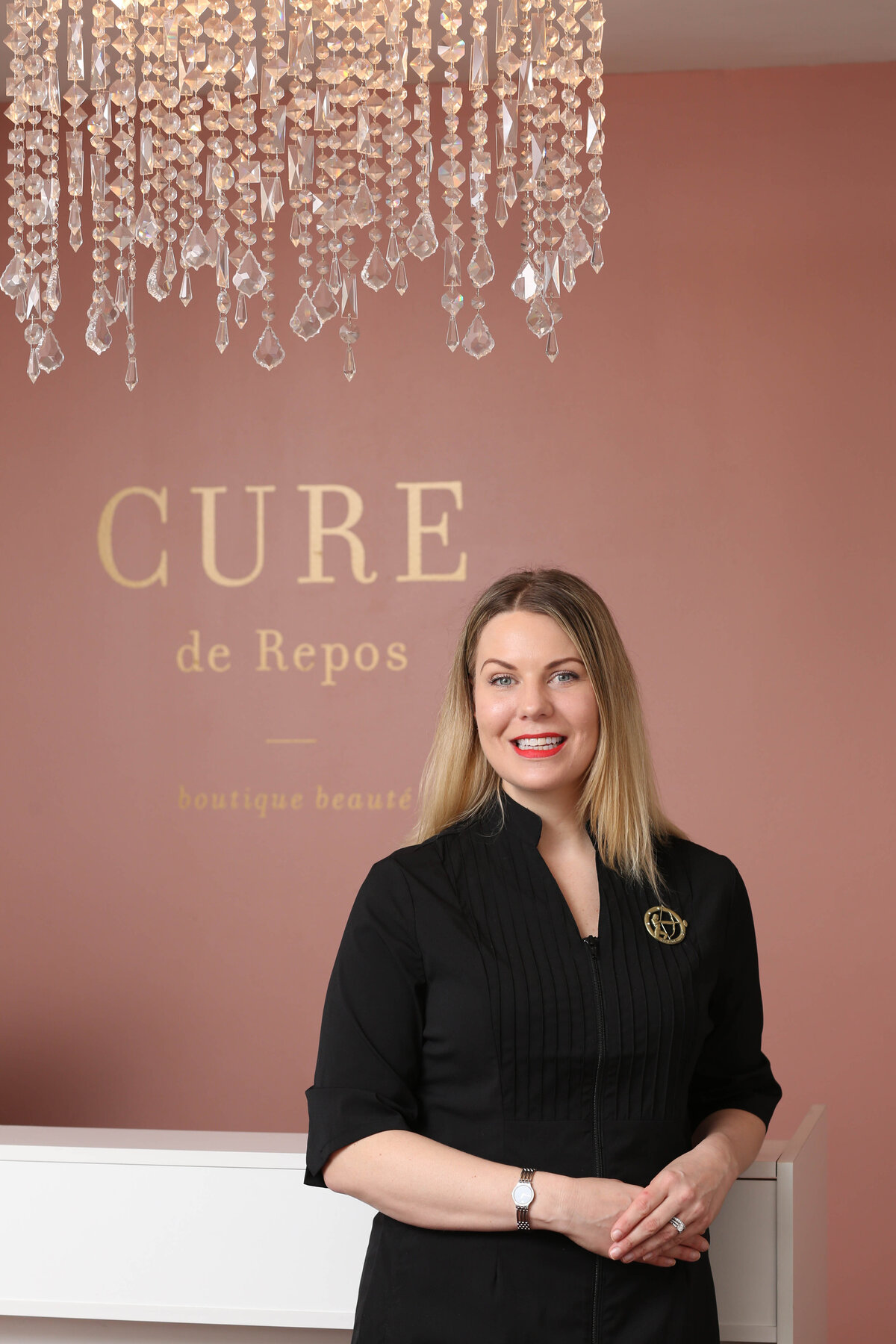 Business owner in front of her signage