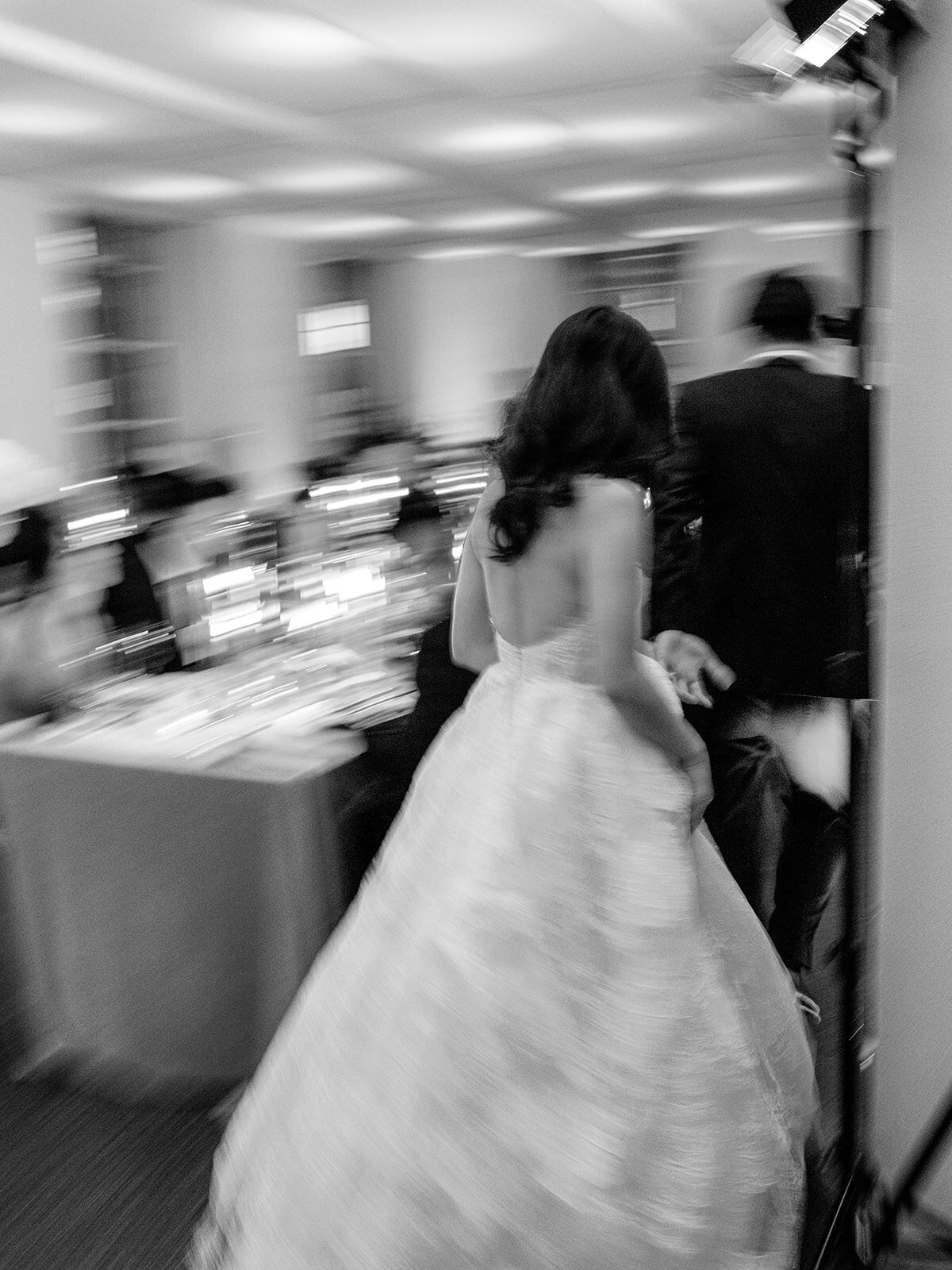Blurry motion photo by Stetten Wilson bride in lace wedding gown