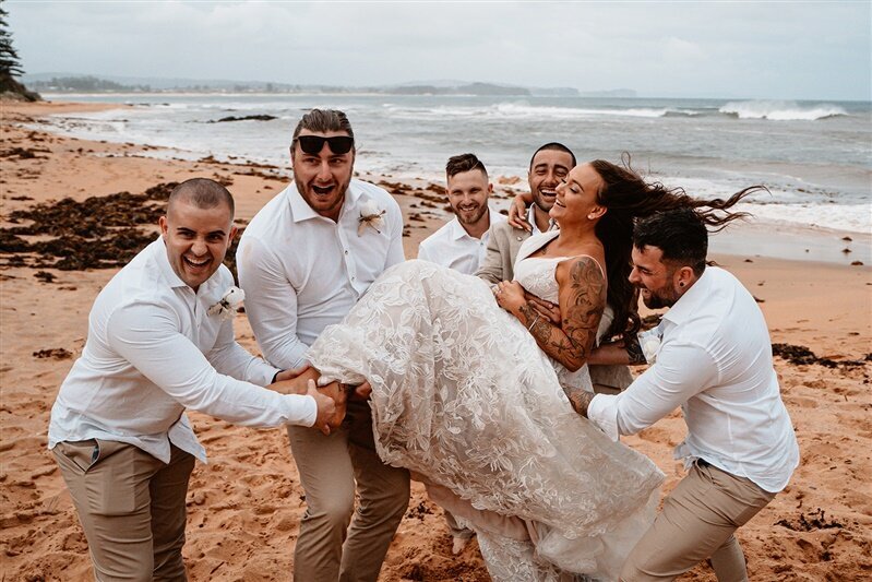 Join Tamara & Matthew, surrounded by their lively bridesmaids and groomsmen, as they capture unforgettable moments during their joyful photoshoot.