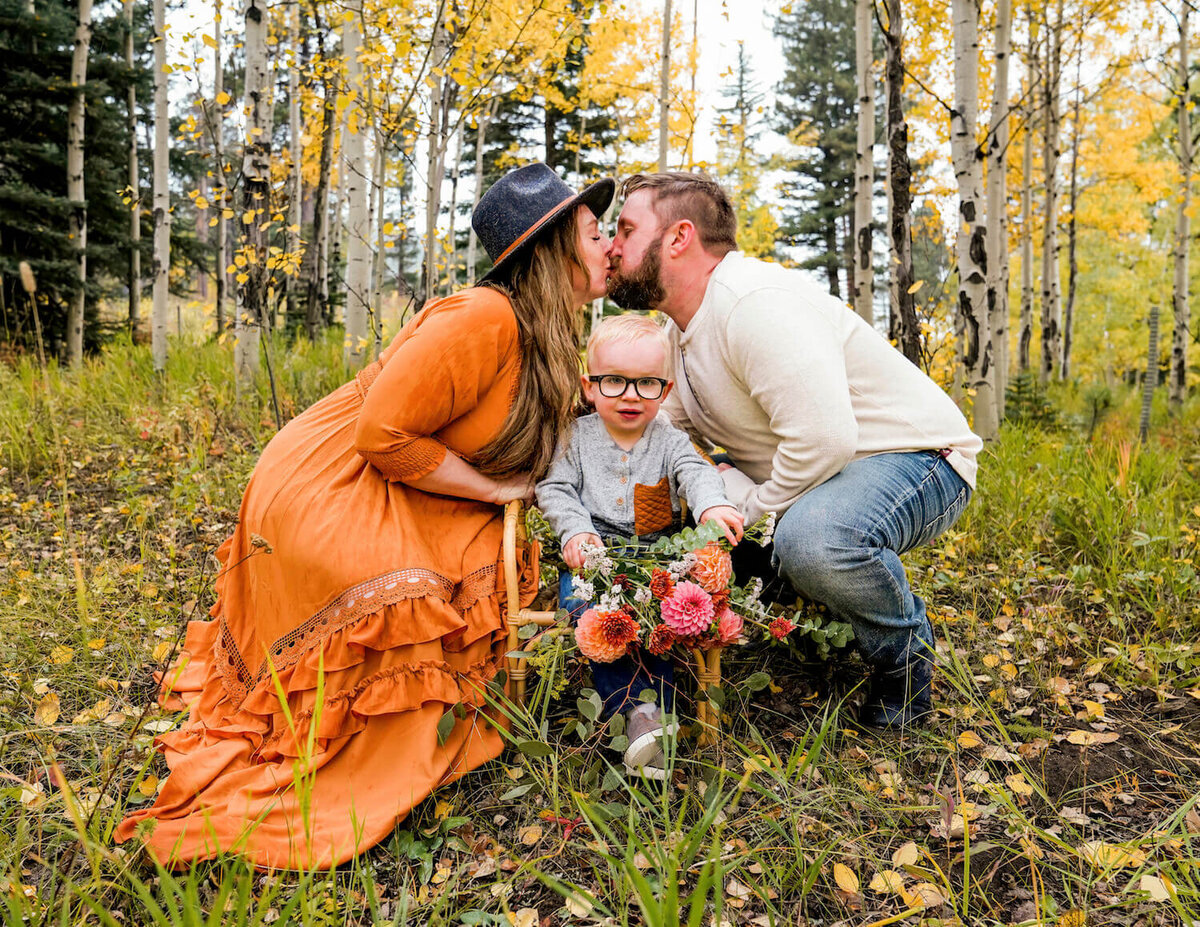 family photography denver co - couple kissing next to young son
