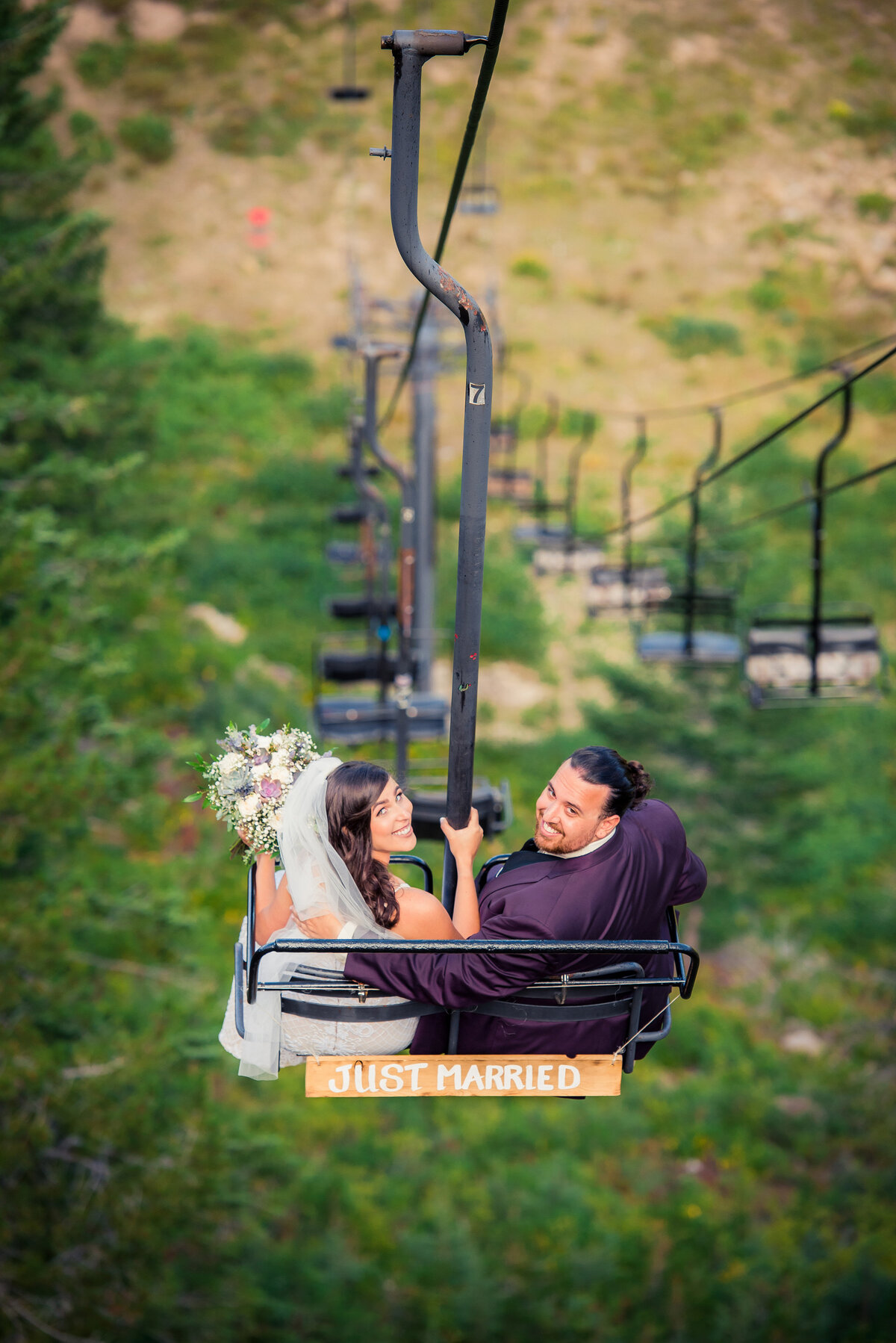 bride and groom on chairlift