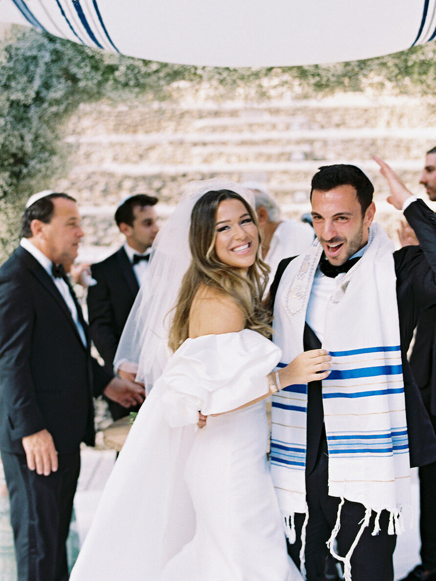 Bride and groom pose after saying I Do at their destination wedding