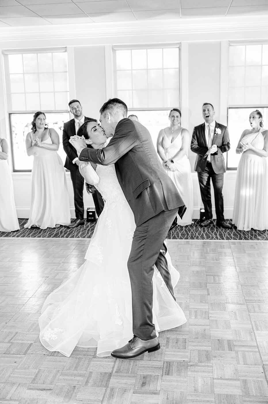 Black and white-film-photograph of couples first dance at wedding