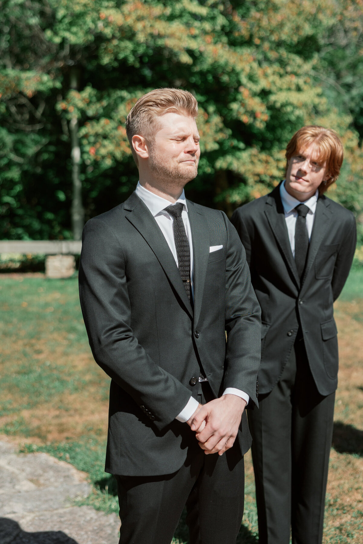 Groom holds back tears during outdoor Dayton wedding, captured by Philadelphia wedding photographer.