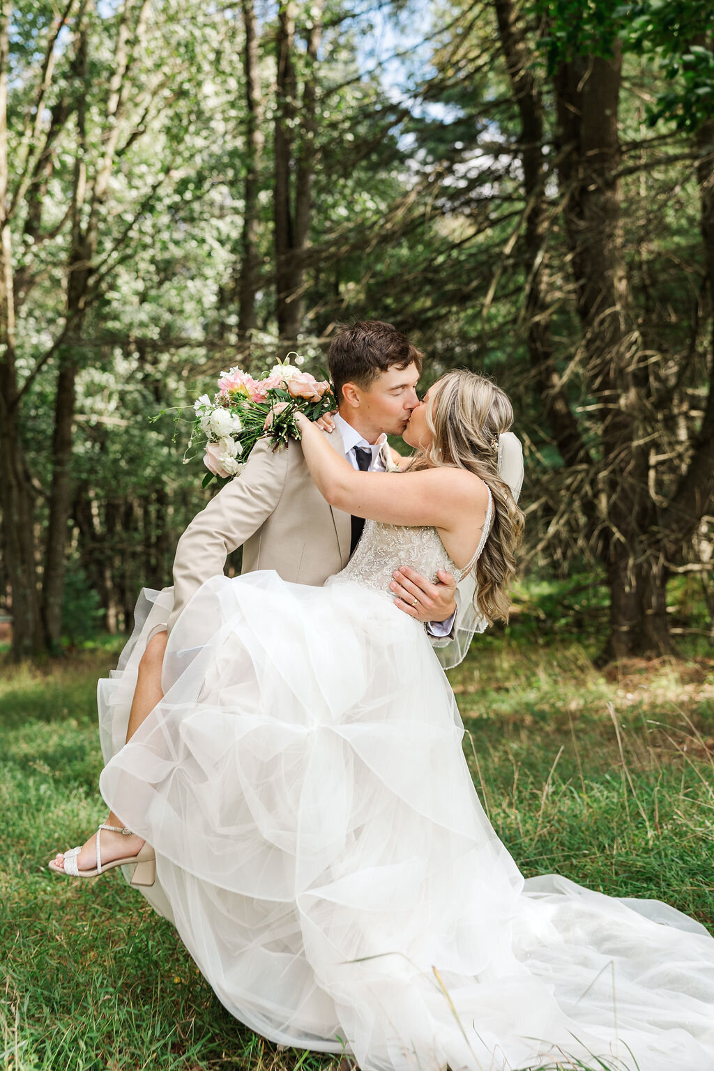Photo of groom dipping his bride.