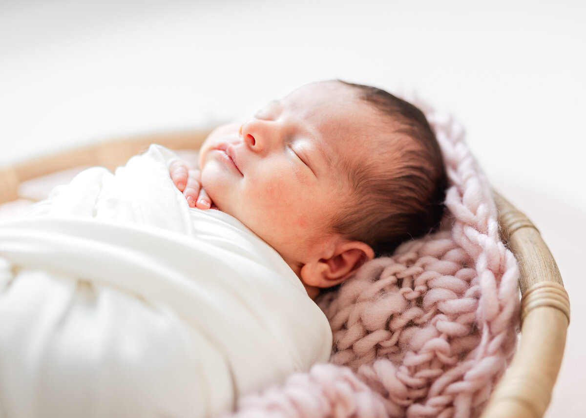 Backlit wrapped newborn photo in Allison Reilly's Union County, NJ photo studio.