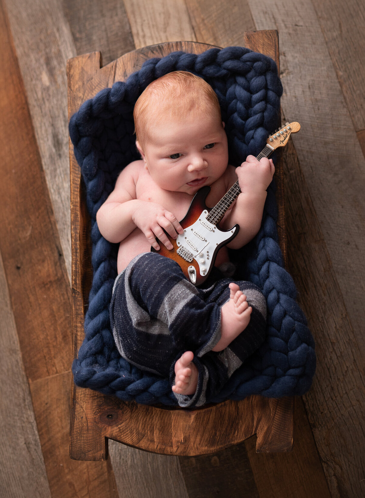 Newborn with guitar creative photoshoot by Laura King