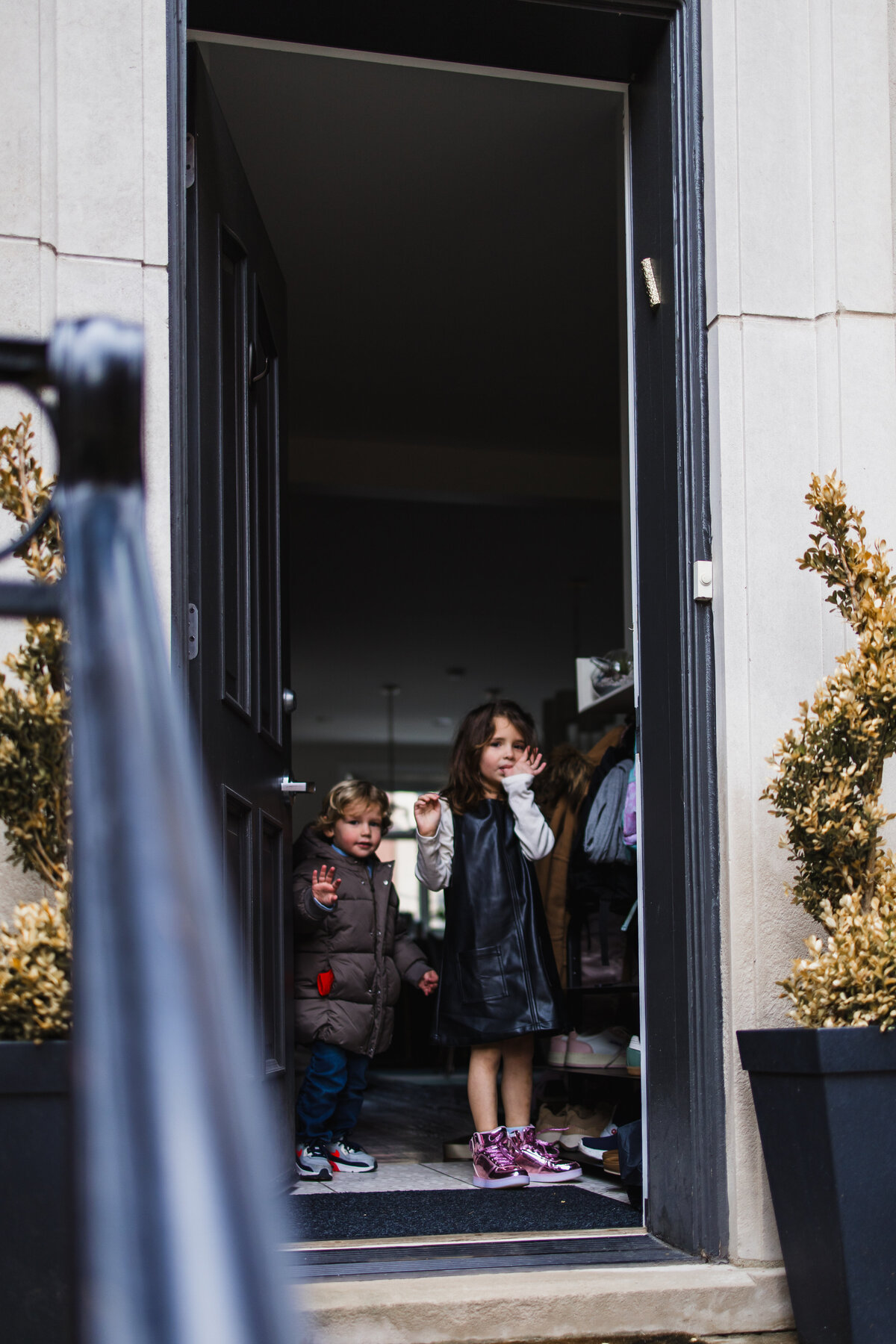 kids looking out the front door