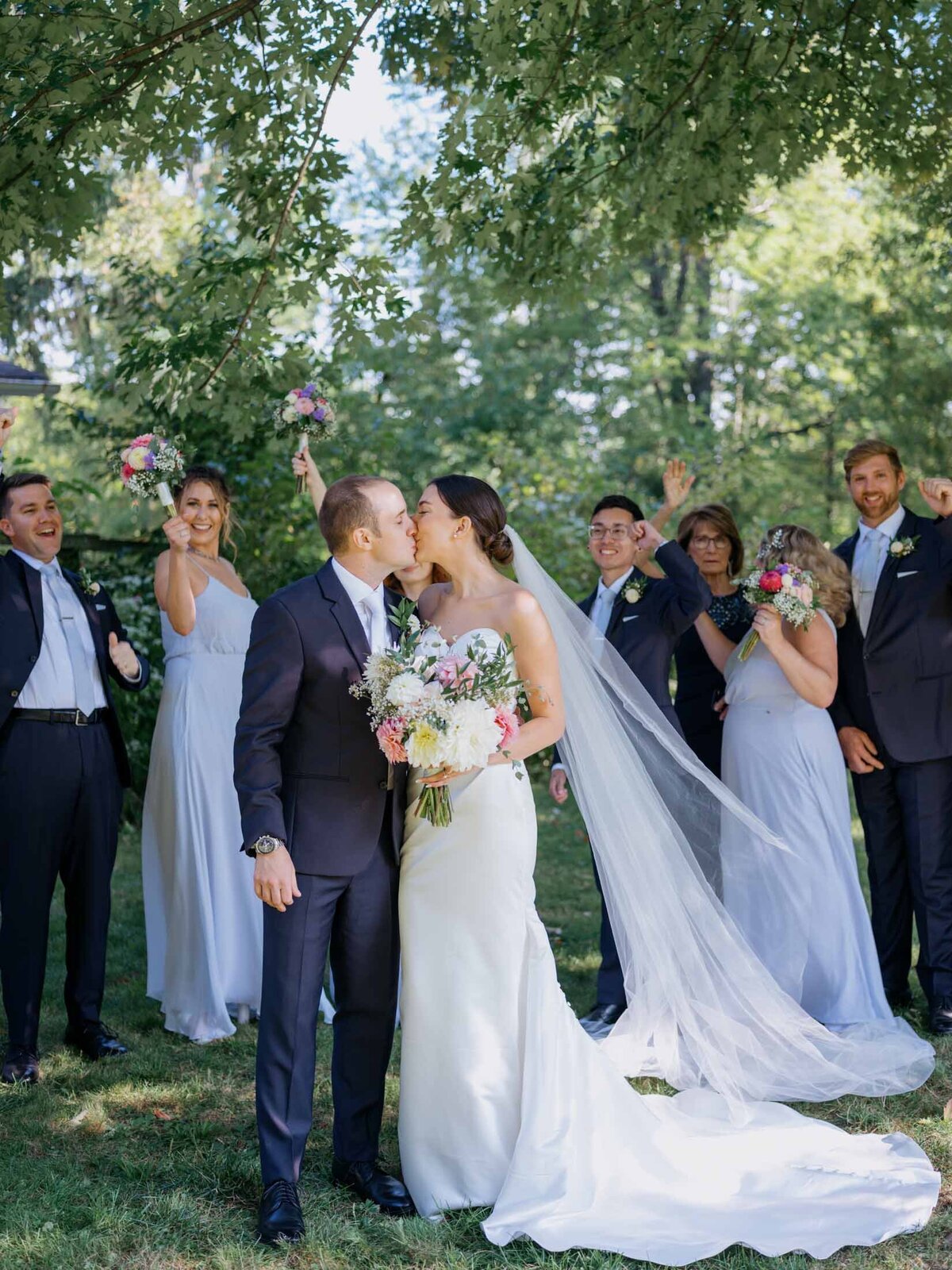 Bridal party with bride and groom at a private residence wedding.
