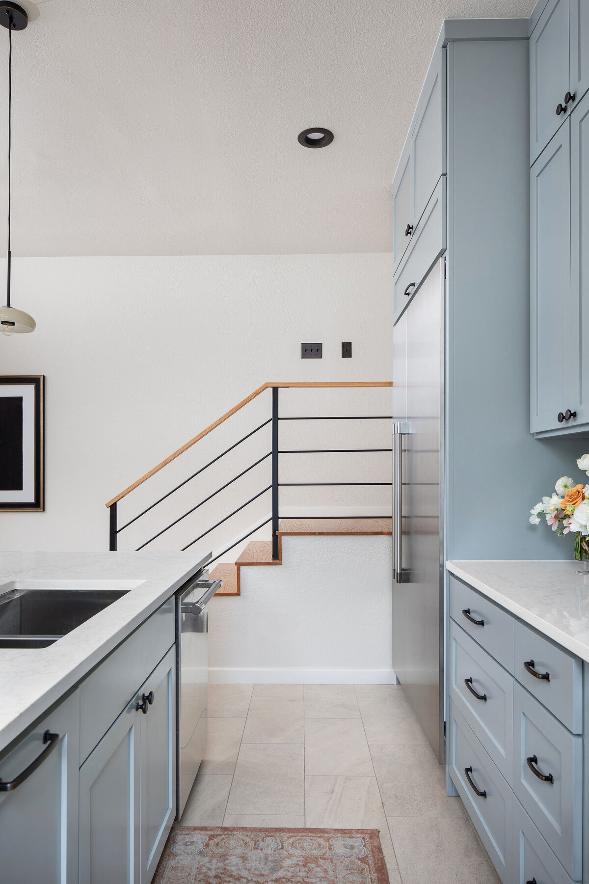 hello-home-modern-kitchen-island-blue-cabinets-minimalist-kitchen-with-staircase-6v2