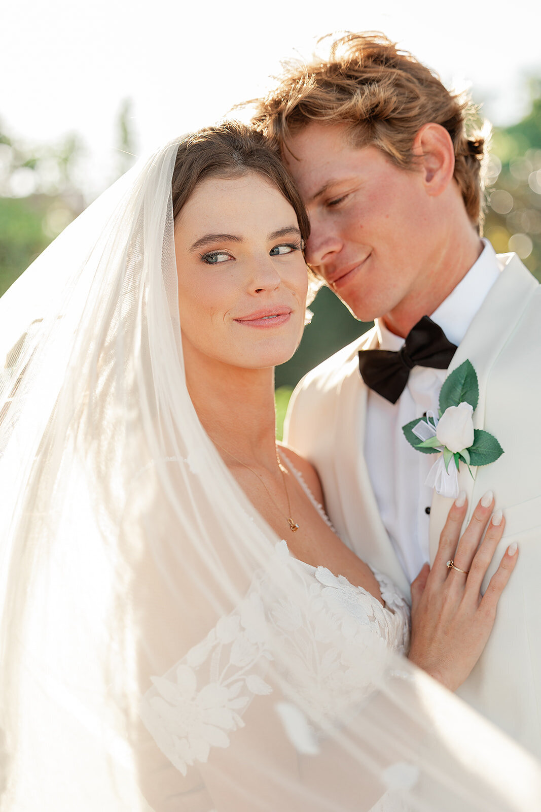 Bride and groom snuggling 