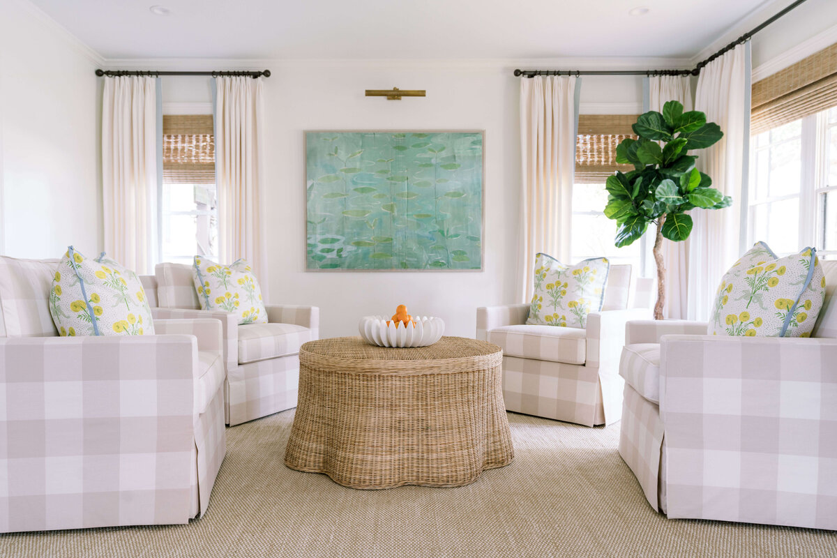 oyster creek studios happy valley tan striped seating with a wicker coffee table in living room