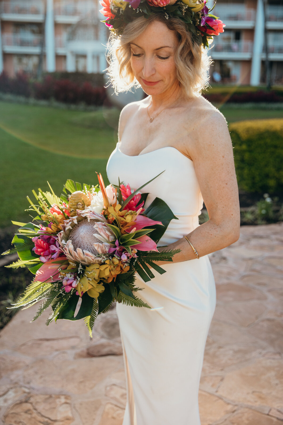 Maui Wedding Photographer captures bride holding tropical bridal bouquet