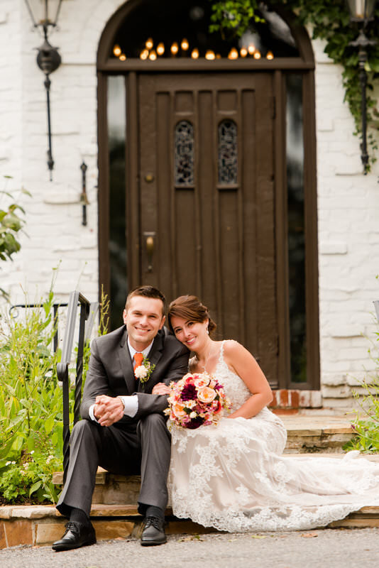 posing for a photo on the front stairs of the Hyeholde restaurant