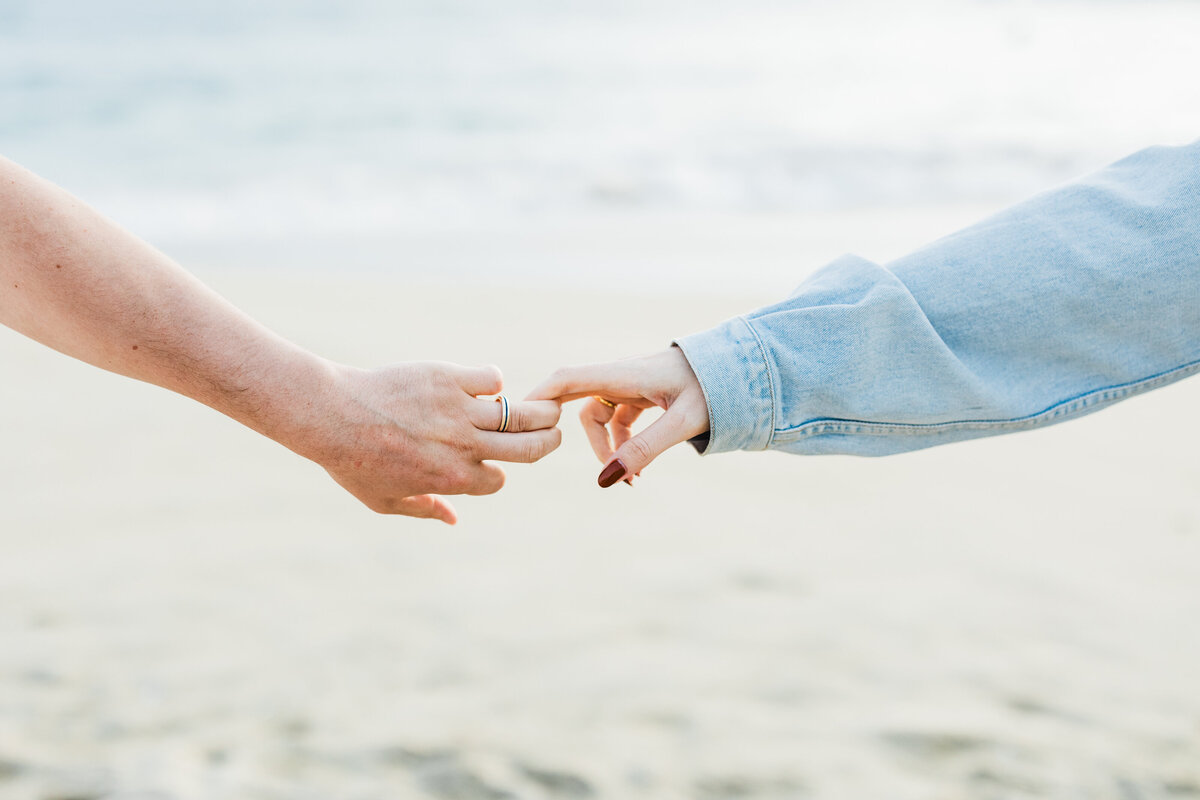 man-and-woman-hands-touching