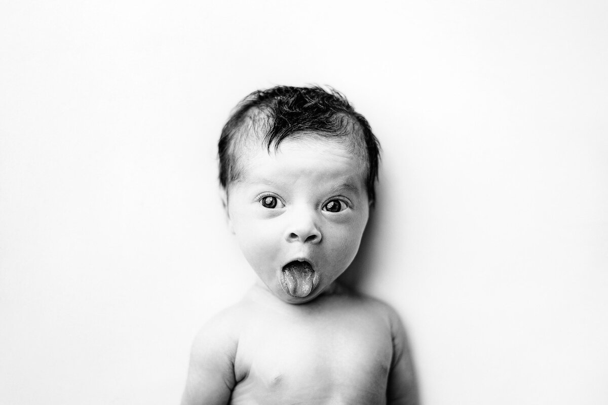 newborn baby personality portrait making a cute and funny expression in east jordan mi