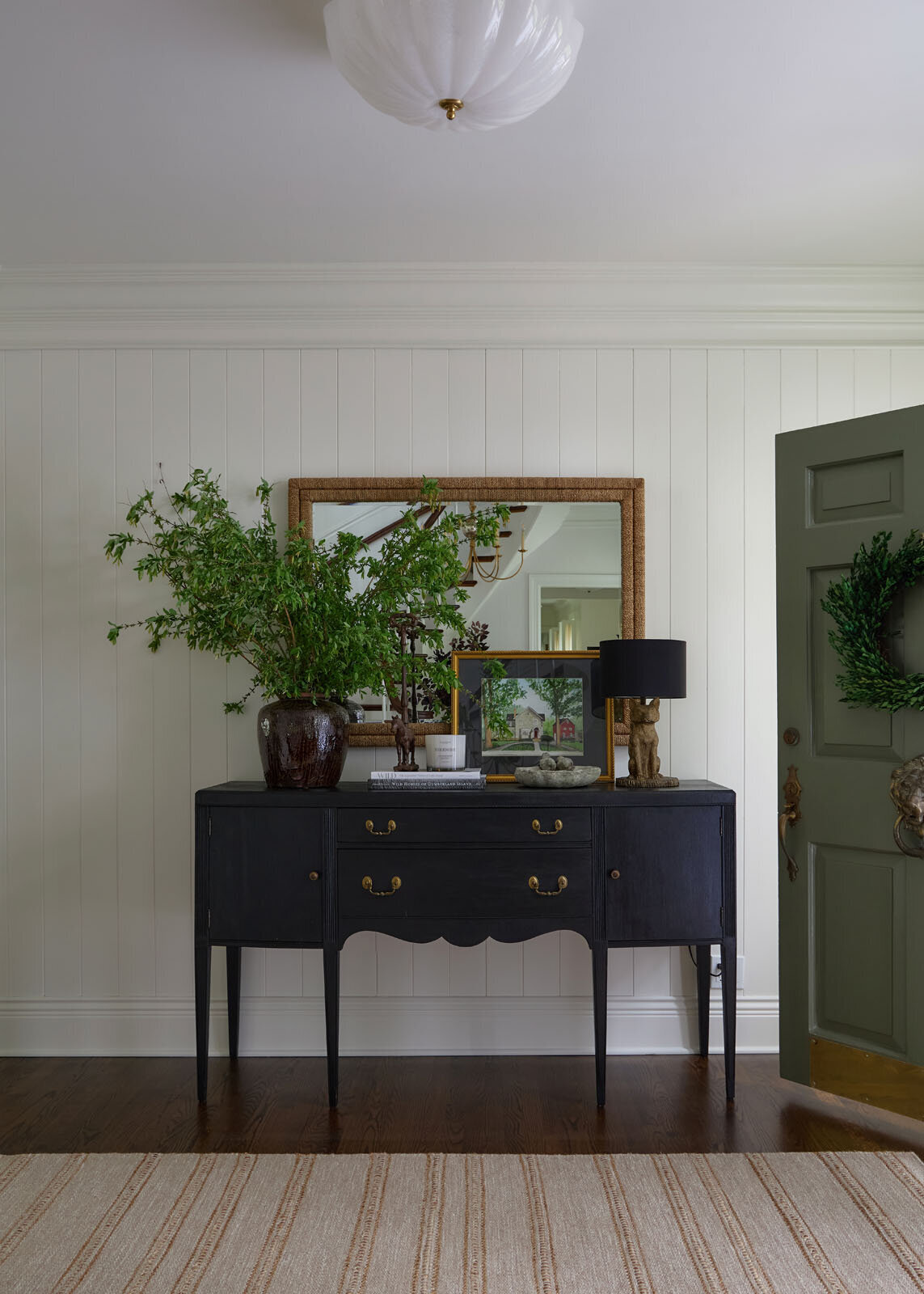 Entry way at project Dunham with black accent console