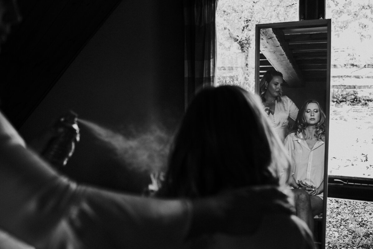 Black and white photo of bride in mirror