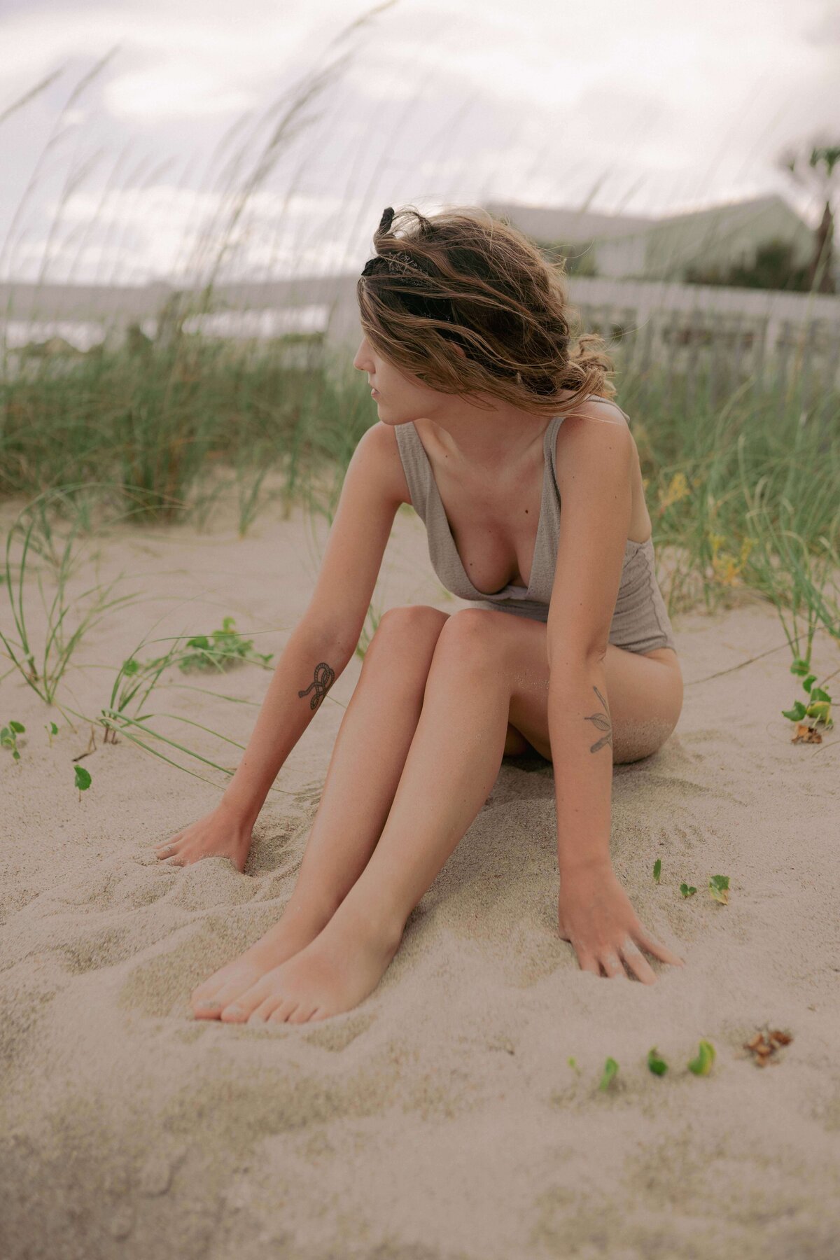 Editorial photography captures model in bathing suit on beach in South Carolina